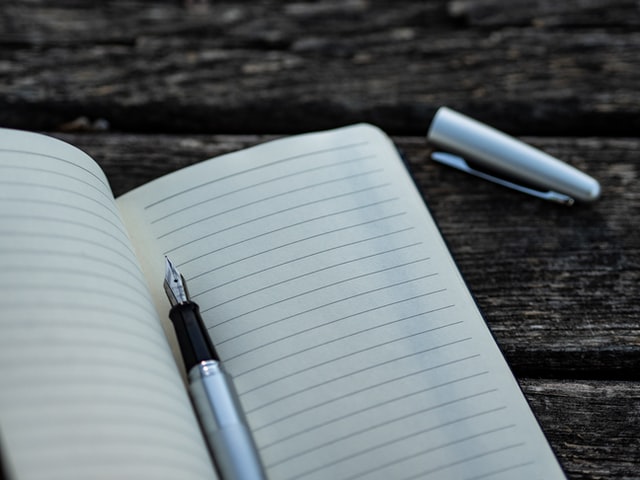 An empty notebook and a fountain pen