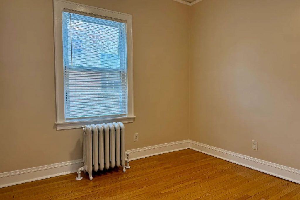 Bedroom with window in 2125 Wesley Ave apartment in Berwyn, IL