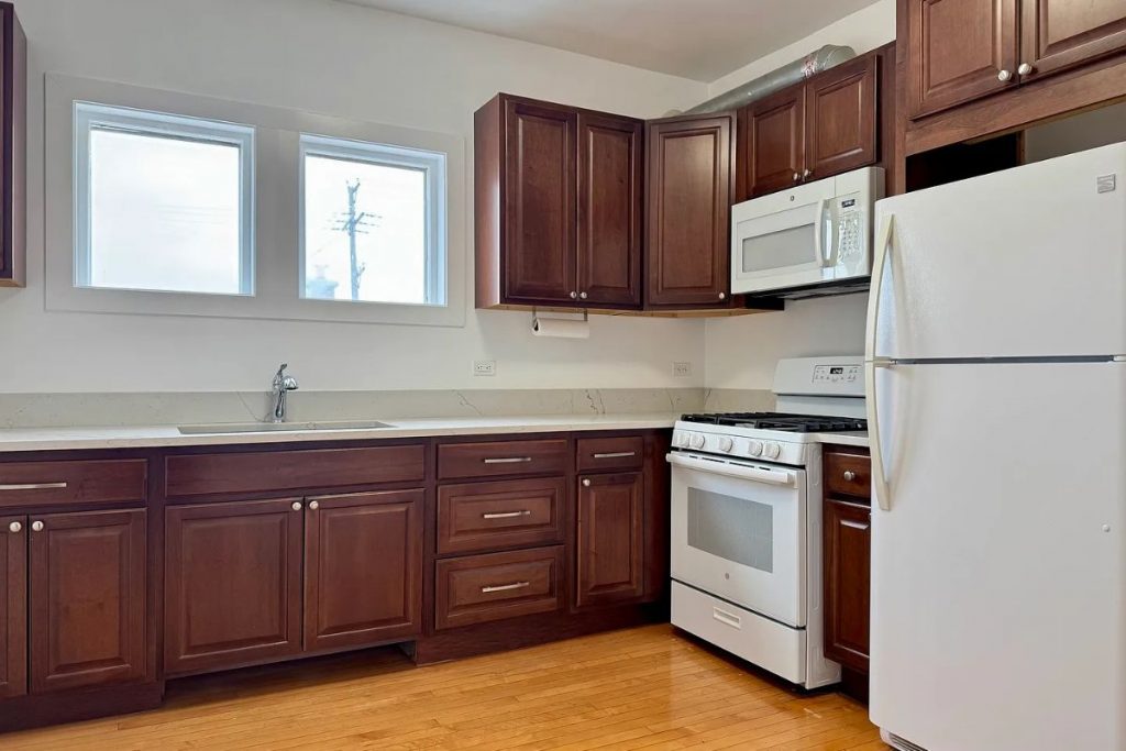Kitchen with cabinet storage in 2125 Wesley Ave apartment in Berwyn, IL