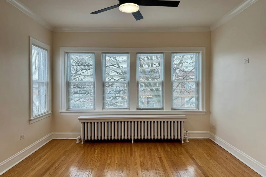 Living room with hardwood floors in 2125 Wesley Ave apartment in Berwyn, IL