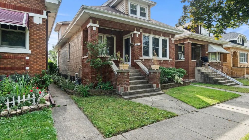 Brick bungalow exterior on a residential street in Berwyn, IL