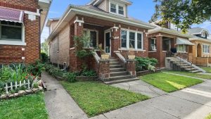 Brick bungalow exterior on a residential street in Berwyn, IL