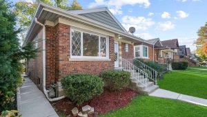 Brick bungalow on a residential street in Berwyn, IL