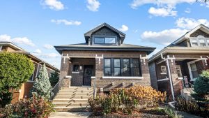 Residential street in Cicero, IL with brick homes and sidewalks