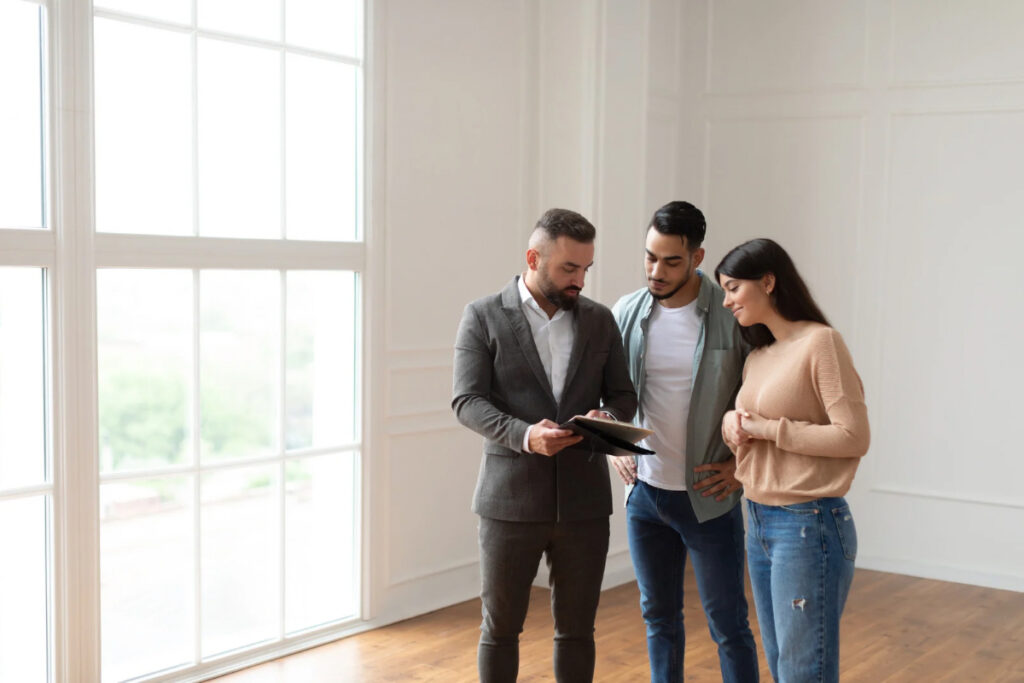 Buyers experiencing room layout during an in-person home showing