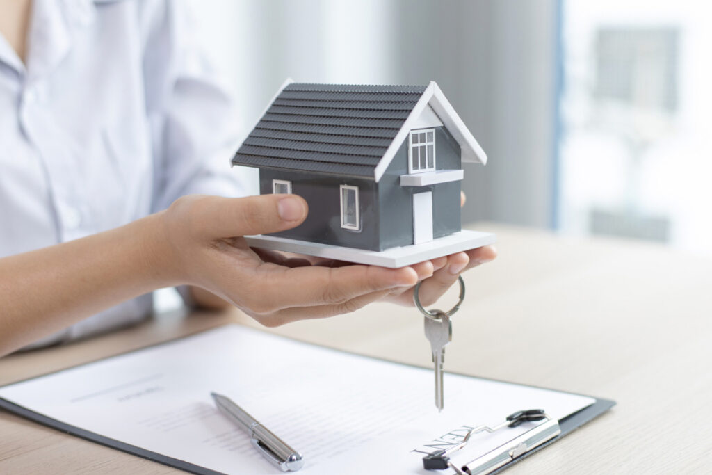 Homeowner comparing selling a house with keeping it as a rental
